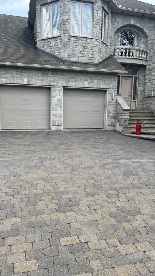 A large paver driveway after the job